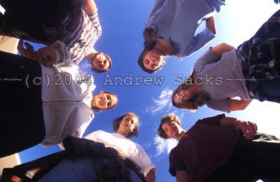 Six high school students gather in a circle 