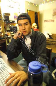 College student at his dorm room desk