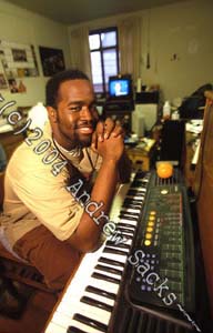 College student at his piano in dorm room 