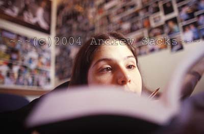 College student reads in her dorm room