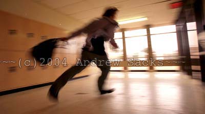 High school student running in hallway