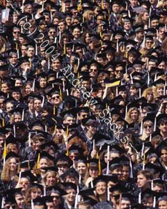 Crowd of graduates at college commencement 