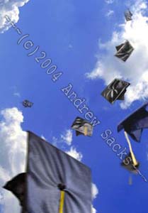 Hats of college graduates thrown in the air