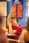 Girl raises hand in classroom