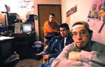 Three guys in their college dorm room