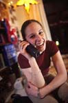 College girl on the phone in her dorm room