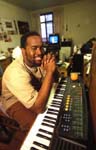 College student at his piano in dorm room 