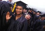 Two girls clowning at college commencement 