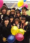 Nine girls clowning at college commencement 