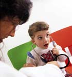 Female pediatrician examines child