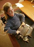 Woman in wheelchair with laptop