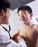 Femal pediatrician with Asian boy